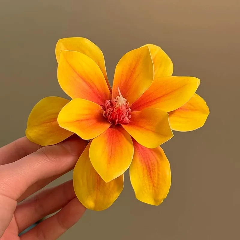 Beach vacation style, yellow flower hair clip, women's travel photography, exaggerated flower bangs, hair accessories
