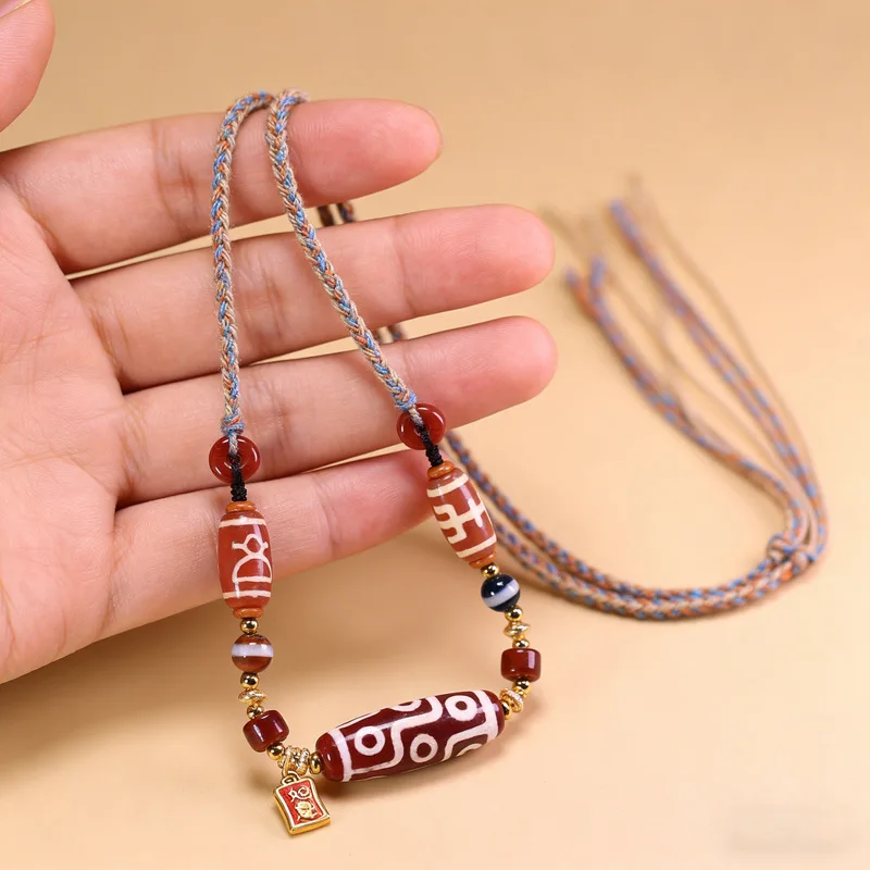 Tibetan natural old mine raw agate nine-eyed dzi bead multi-treasure necklace, approximately 13x38mm