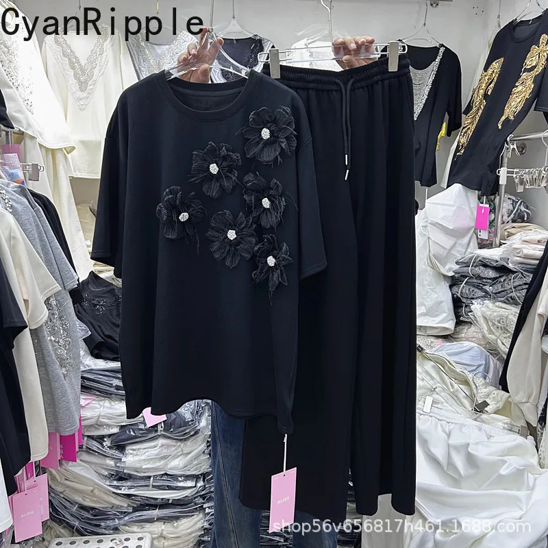 

Новый весенне-летний женский комплект из двух предметов: белая футболка с коротким рукавом и цветочным узором из бисера + повседневные прямые брюки с эластичным поясом и широкими штанинами