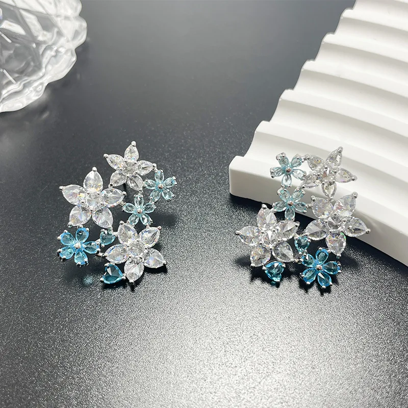 Copper Floral Zircon Earrings - Sky Blue Transparent Zircon Cluster Leaf Hollow Design White Background