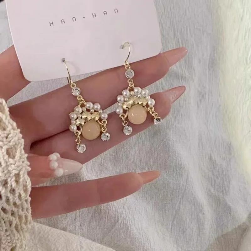 2024 new fashion chinese style opera inspired pearl cat eye earrings simple elegant retro sophisticated design with tassel accen