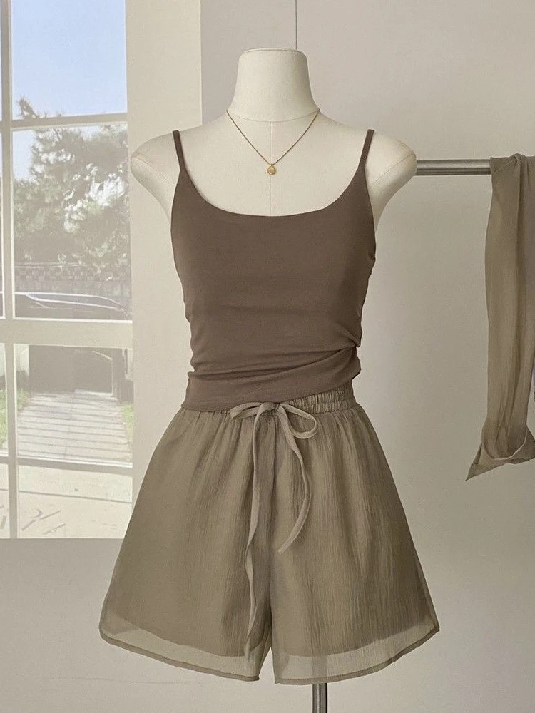 

Женский летний тонкий солнцезащитный топ, свободный крой и топ на бретелях для похудения, комплект из футболок, модная весенняя коллекция...