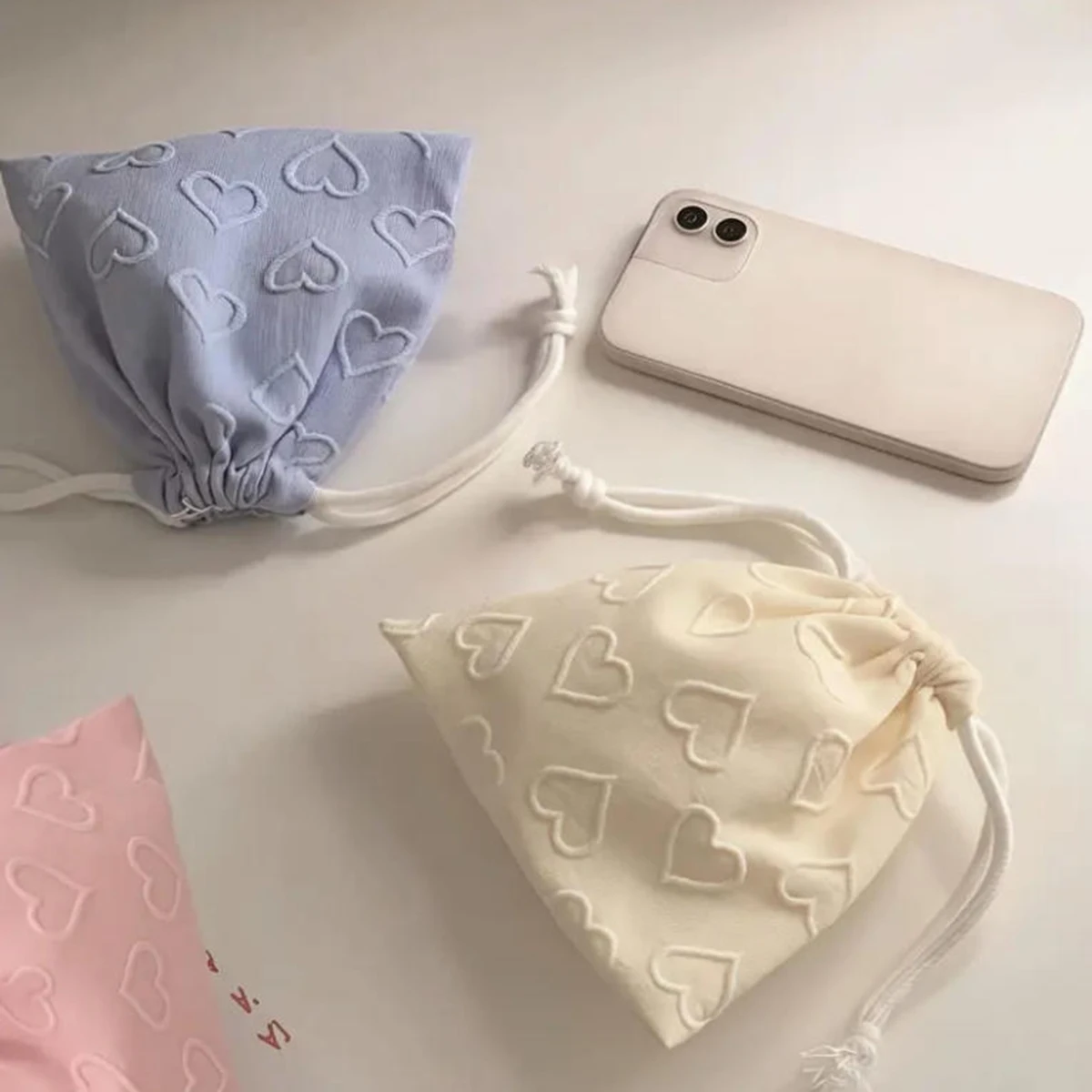 

3D heart-shaped embossed drawstring pocket, macaron color triangle design, cute headphone storage bag