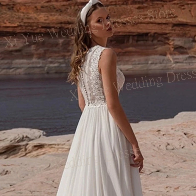 2025 Boho elegante O-cuello vestidos De novia una línea Apliques De encaje sin mangas vestidos De novia ilusión playa personalizado Vestido De novia