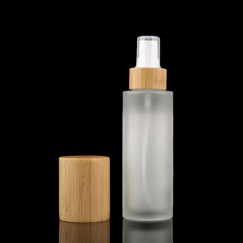 

whosesale Frosted Clear bottles with bamboo Mist Spray tops bamboo lotion bottle for essential oil container，costemic container