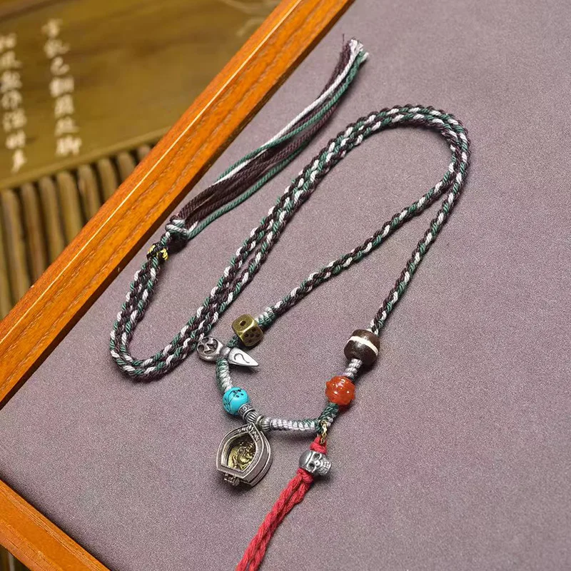 Tibetan-style returned Gahu box with Yellow Wealth God pendant, sweater chain, one-line Dzi bead, and South Red Agate braided ro