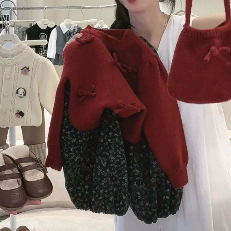 Suéter dulce para niña primavera y otoño nuevo jersey de punto con nudo dulce rojo para bebé ropa bonita de moda para niños