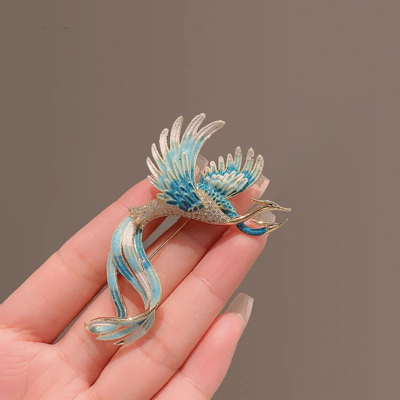 Broche phénix haut de gamme de style chinois pour femme, luxueuse et élégante avec un charme de personnalité unique.