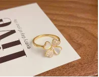 

Korean version of Full Zirconium Light Luxury Four Leaf Clover Open End Ring, high-end, niche, versatile, non fading cross-borde