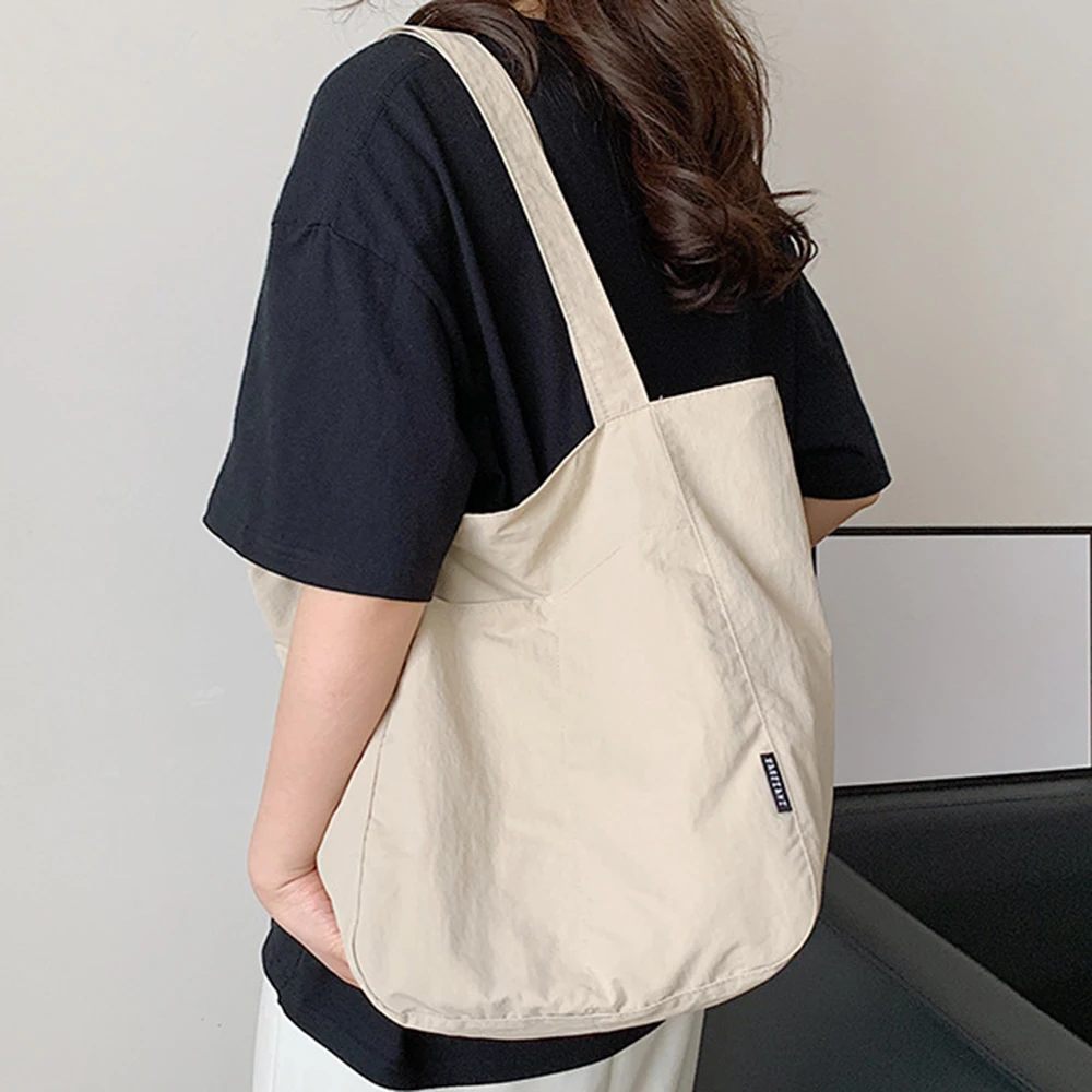 

2025 женская новая водонепроницаемая нейлоновая повседневная сумка на плечо, большая вместительная сумка-тоут, однотонная дорожная сумка, сумка с верхней ручкой