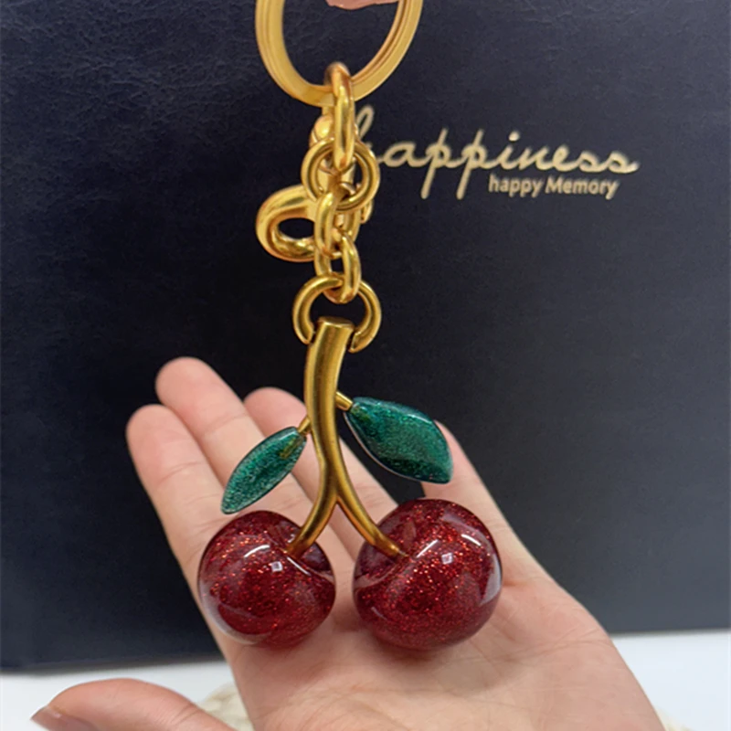 

Internet-famous Green Leaf Crystal Cherry Pendant Decoration For Coach Handbag Shoulder Bag Exquisite Keychain Attachment Part