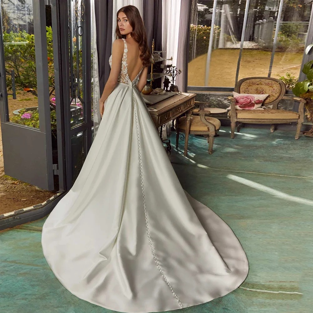 カスタマイズされた優雅なAラインのウェディングドレス、レースのボディス、Vネック、フロントスリット、ブライダルガウン、V字型のバック、ノースリーブ、ベスティドス・デ・ノビア