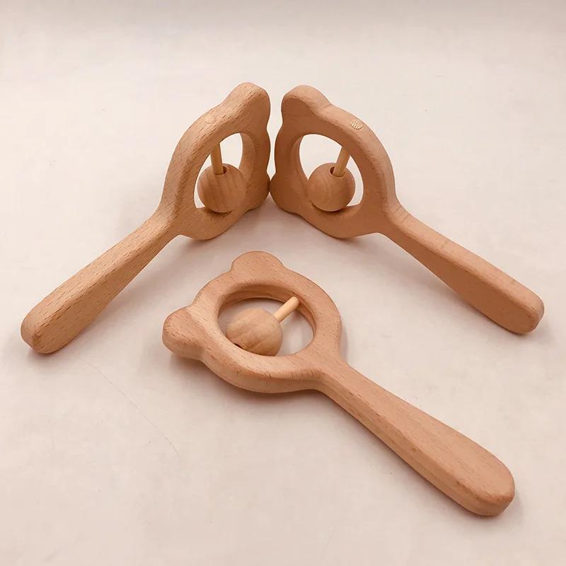 Hochet musical Montessori dos TeWindsor en bois de hêtre naturel pour bébé, jouet d'entraînement à la main, jeu à mâcher, salle de sport, cadeau pour nouveau-né