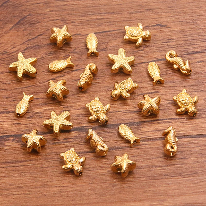 5 Stück Edelstahl-Abstandshalterperlen in Gold mit Seestern-, Fisch-, Schildkröten- und Seepferdchen-Motiv für DIY-Schmuckherstellung von Halsketten und Armbändern. – Detail 3