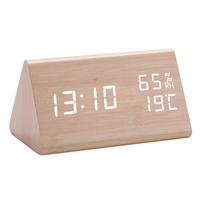 Digital alarm clock made of wood with LED display showing time indoor temperature and humidity switchable 12/24 hour formats