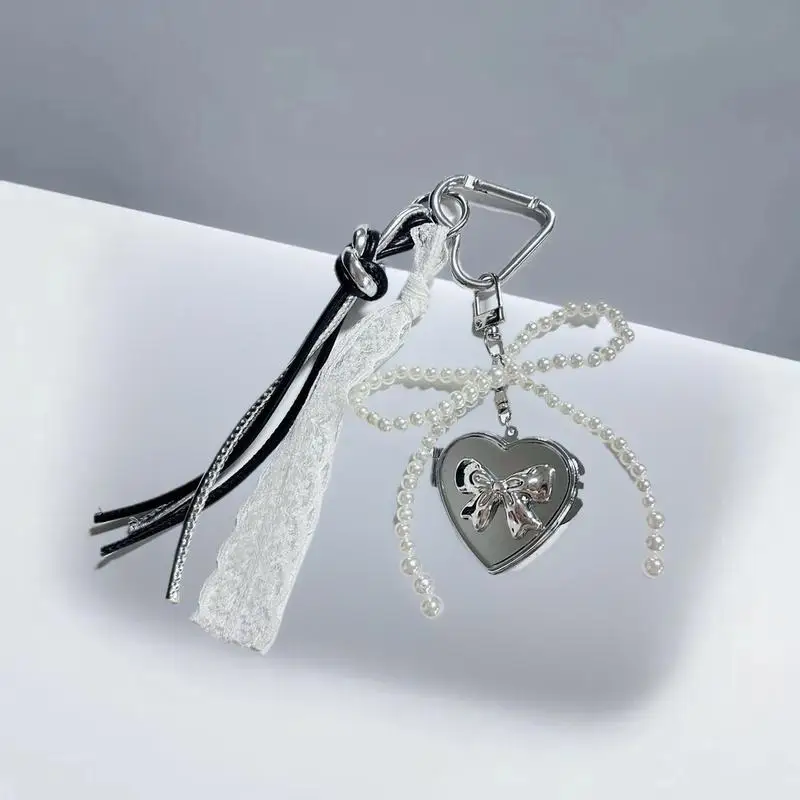 

Adorable Pearl Bow Keyring with Y2K Style, Silver Heart Mirror Pendant, Fashion Bag Charm for Girls
