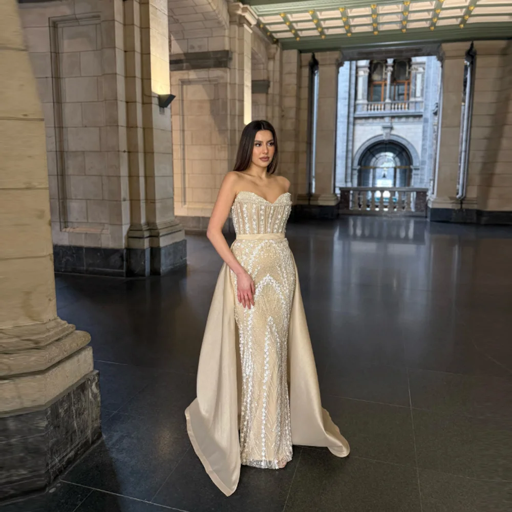 Custom-made, backless, strapless mermaid wedding dress featuring an elegant train—perfect for a birthday party or wedding.