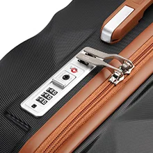 Close-up of a digital combination lock attached to a brown leather surface, likely part of a suitcase or briefcase.