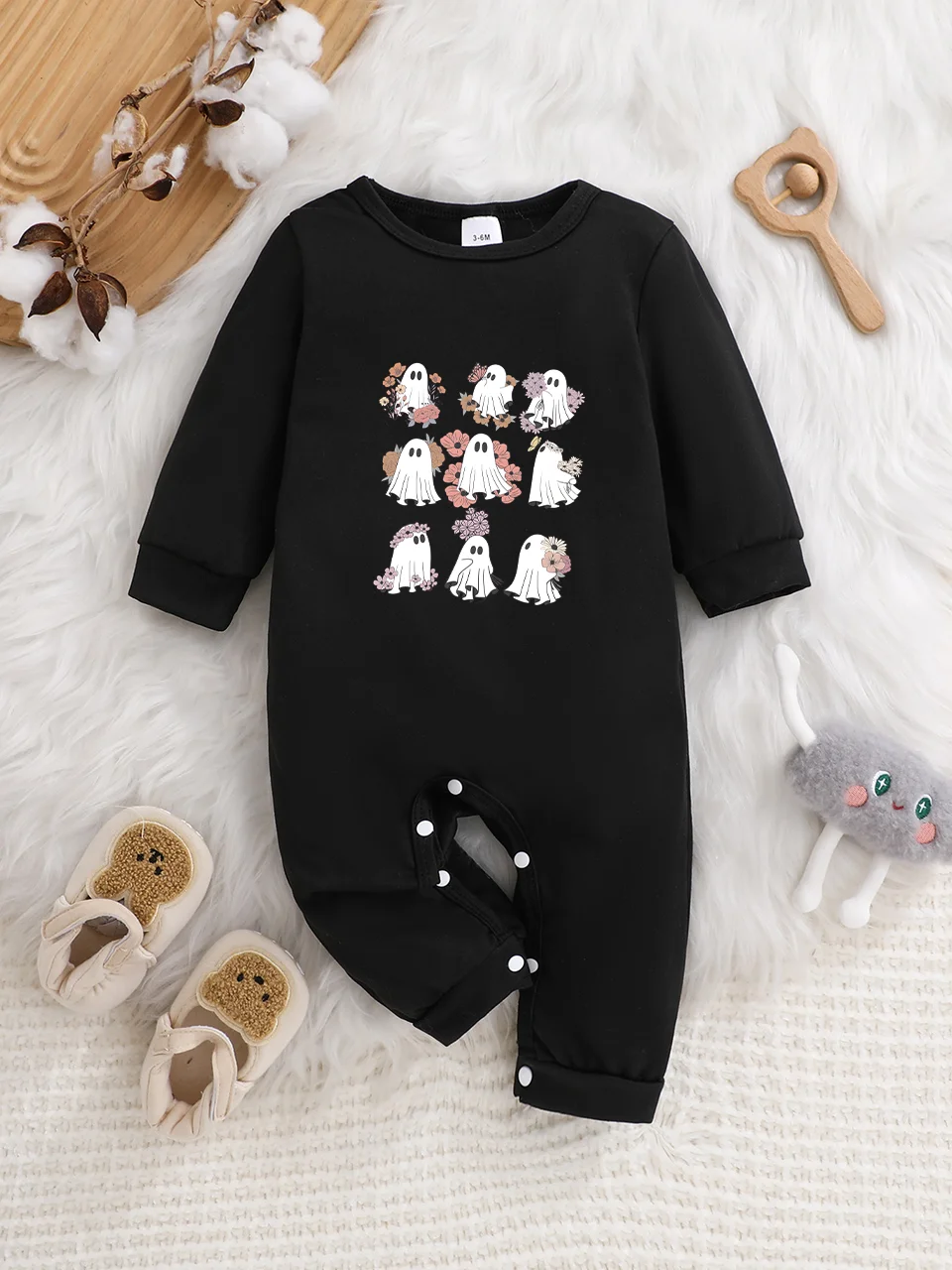 A baby long-sleeved onesie with interesting letter prints. It features a buttoned design for easy putting on and taking off, and