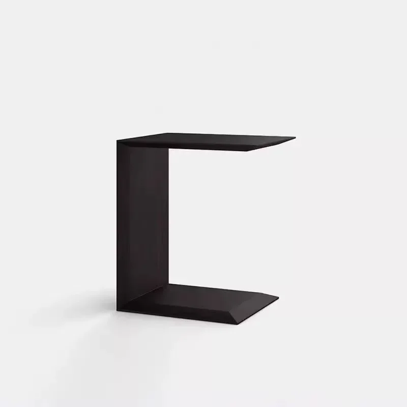 Simple black oak edge, small apartment living room sofa next to the corner