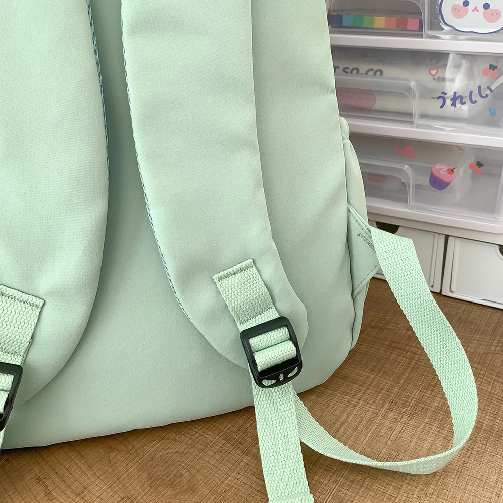 대학생 배낭 대용량 캐주얼 책가방 귀여운 펜던트가 있는 나일론 조절 가능한 스트랩 십대 소녀들을 위한 패션