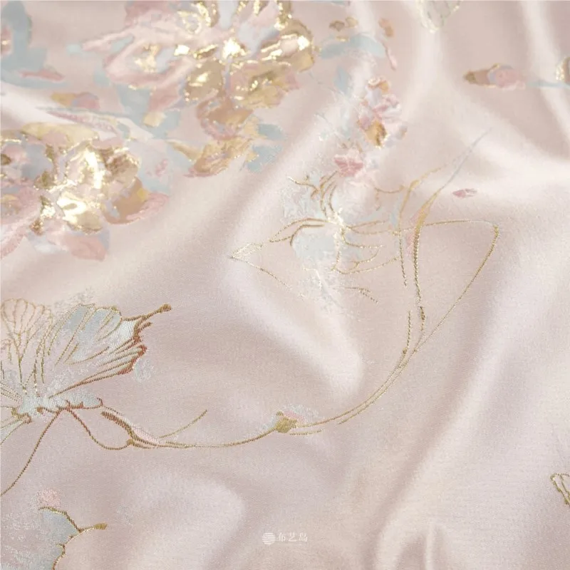 Light pink beige gold thread floral satin fabric for the coat and armor designed by a Hanfu designer