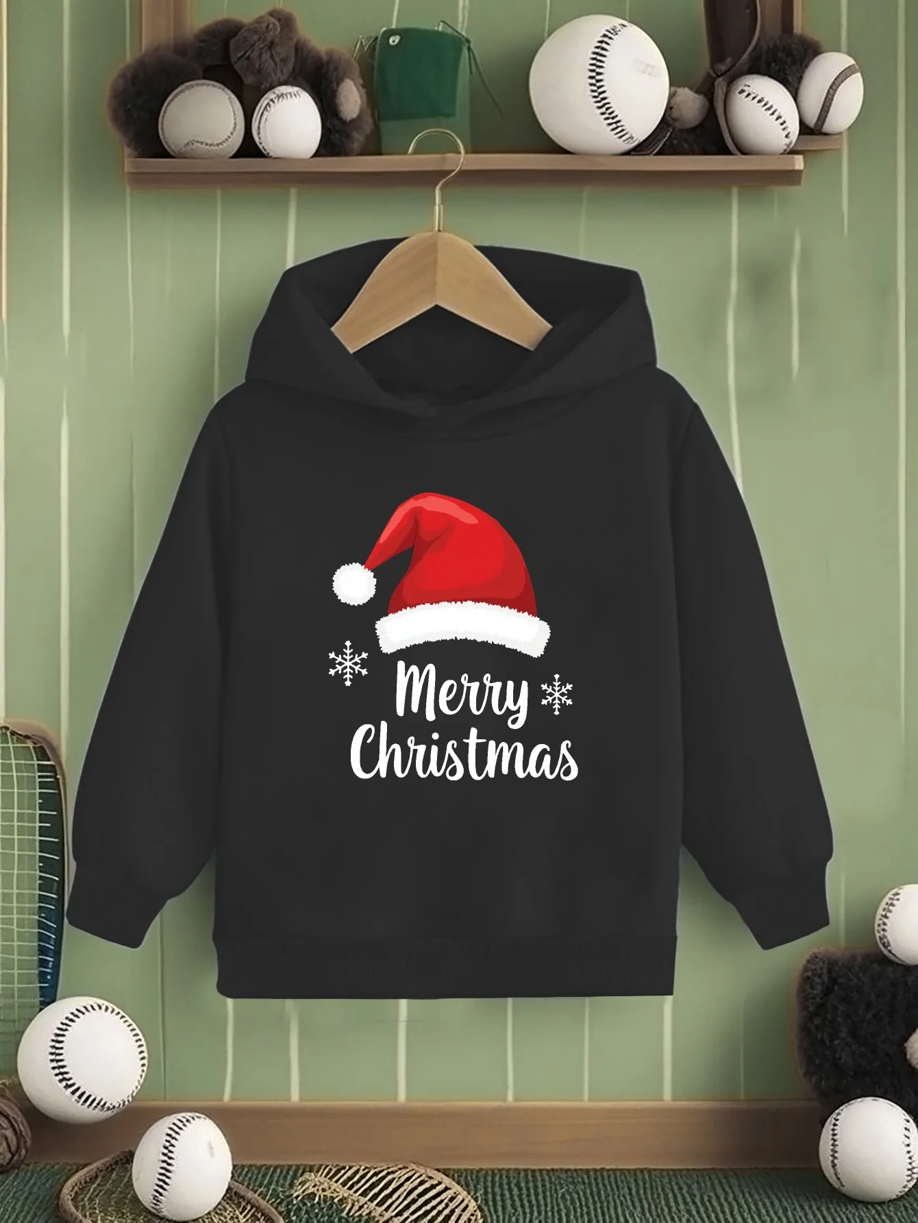 

Children's black Santa hat and snowflake patterned hooded sweatshirt with the words' Merry Christmas'