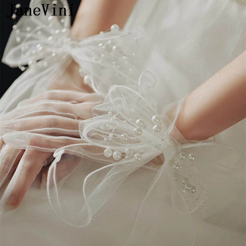 Janevini 2024 neue Perle Bogen Frauen Hand Hochzeit Handschuhe Braut weiß schiere Tüll kurze Braut handschuhe Party Accessoires Mariage Femme