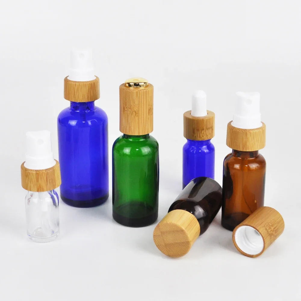 

Popular selling pesonal Amber Blue Green Clear Glass Spray Bottle with Bamboo Spray Cap Lid eco friendly bamboo pump spray