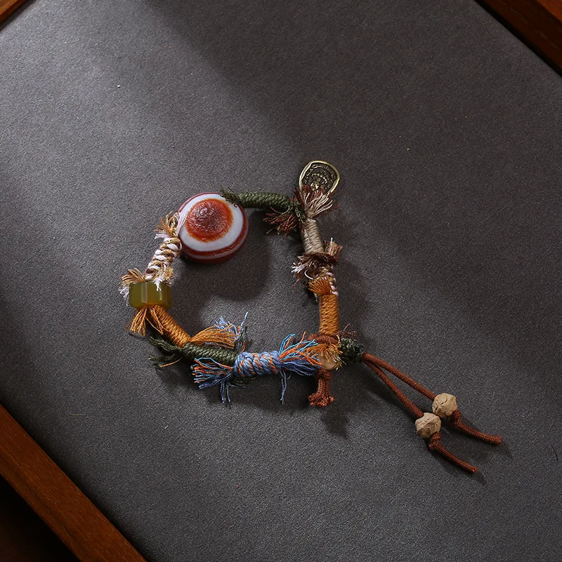 

Браслет из натурального агата и камня "овечий глаз" в сочетании с медным кулоном Ганеши, ручной работы, в этническом стиле.