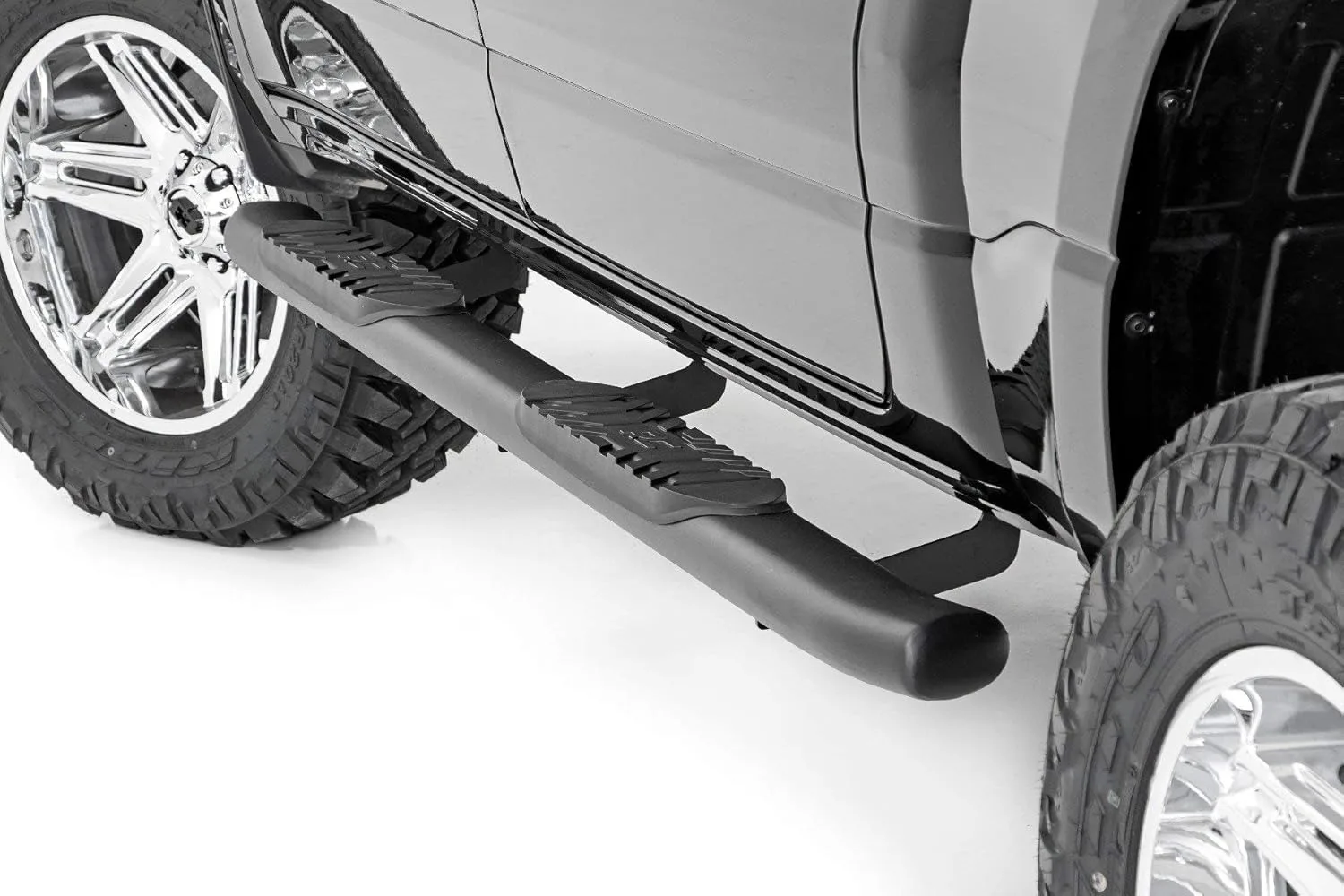 

Rough Country Oval Nerf Steps for Ram 1500 (2019-2025) 1500 TRX (2021-2024) Crew Cab - OEM Style Rails with Built-in Side Step