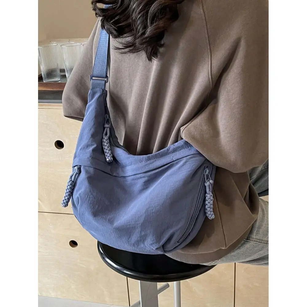 

This Fashionable Colorful Nylon Waterproof Shoulder Bag Features A Simple And Casual Collegiate Design, With A Wide Strap, Mult