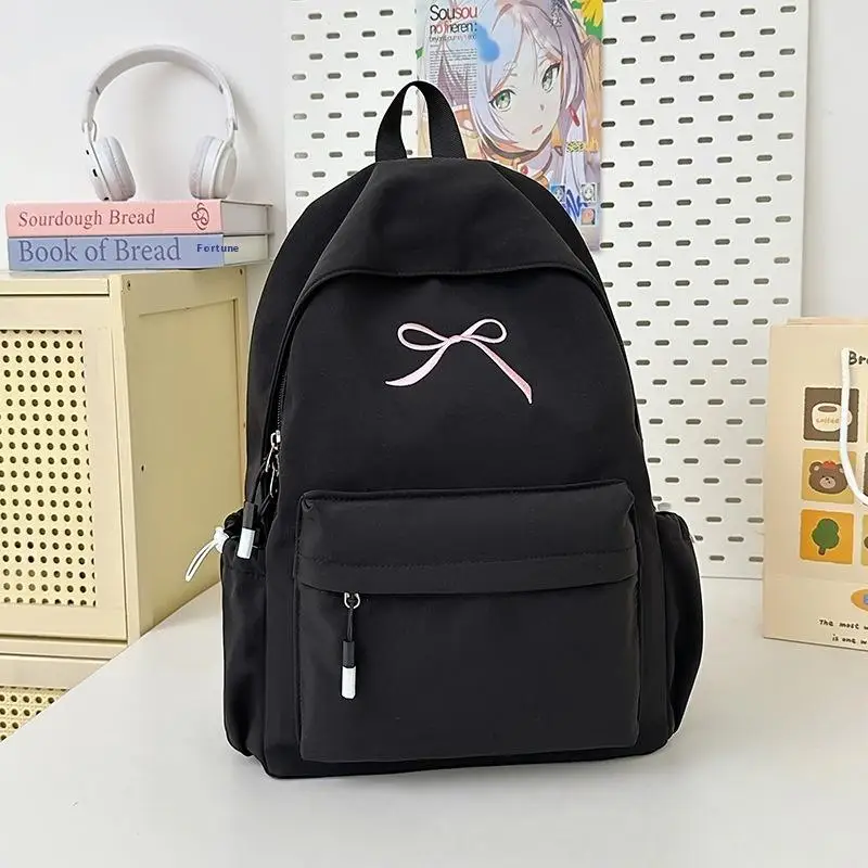 กระเป๋าเป้สะพายหลังสีพื้นน่ารักสไตล์เกาหลี ความจุเยอะ น้ำหนักเบา เหมาะสำหรับเดินทาง ปักลายโบว์  กระเป๋านักเรียน ของขวัญ