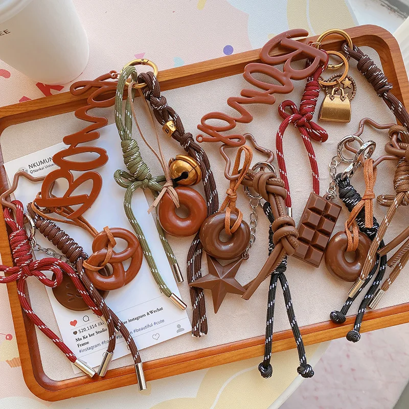 HD12123 Chocolate alkaline water bagel car keychain collection! Creative niche woven rope bag pendant