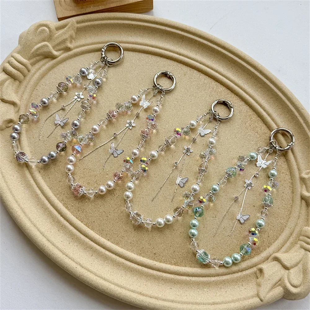 

Новый корейский жемчужный ремешок для мобильного телефона, портативный цветочный браслет, цепочка для телефона с бабочкой, брелок для ключей, ювелирное изделие для девочек, подарок, анти-потерянная цепочка