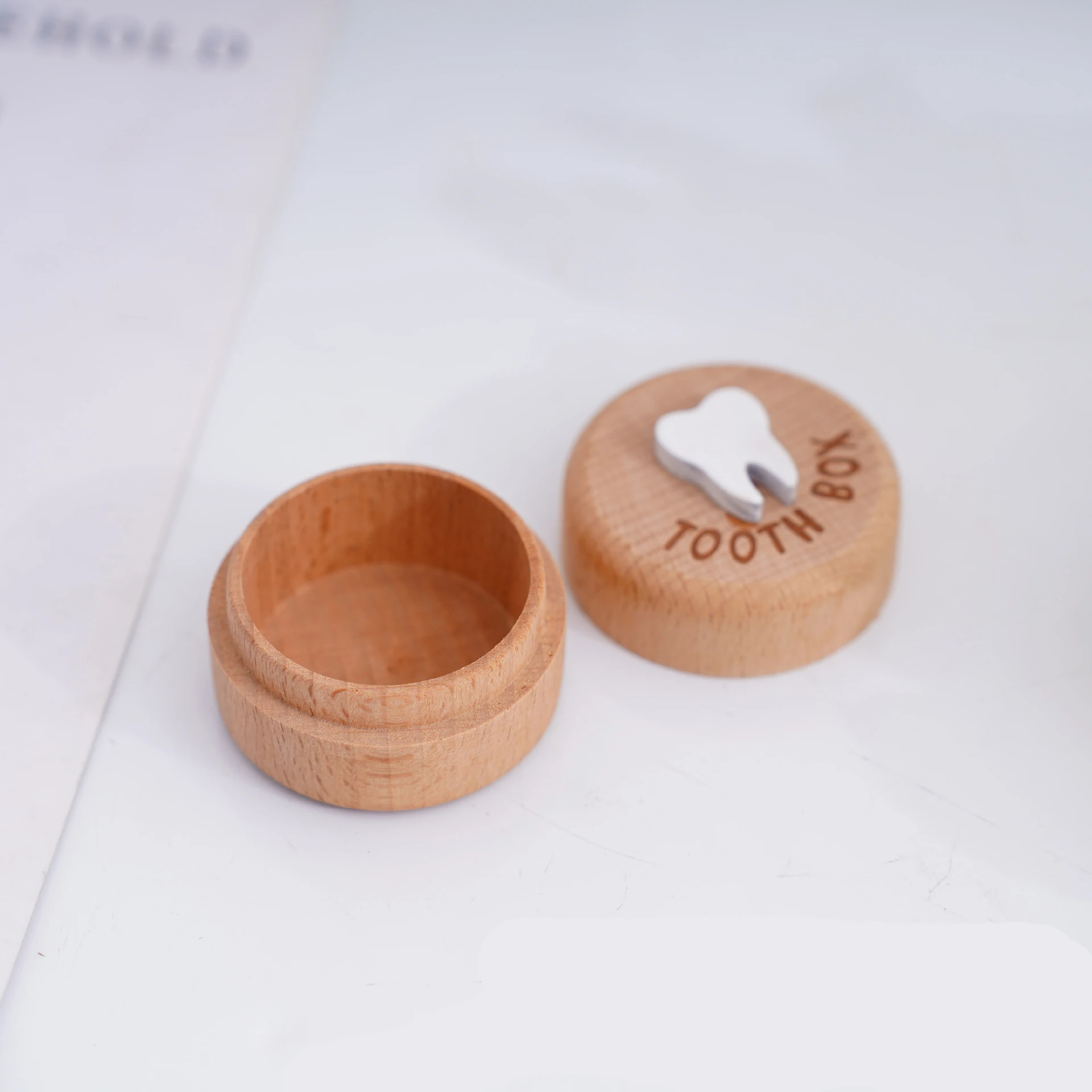 Simple circular solid wood baby teeth storage box with engraved words to commemorate baby teeth, fetal hair, and precious storag
