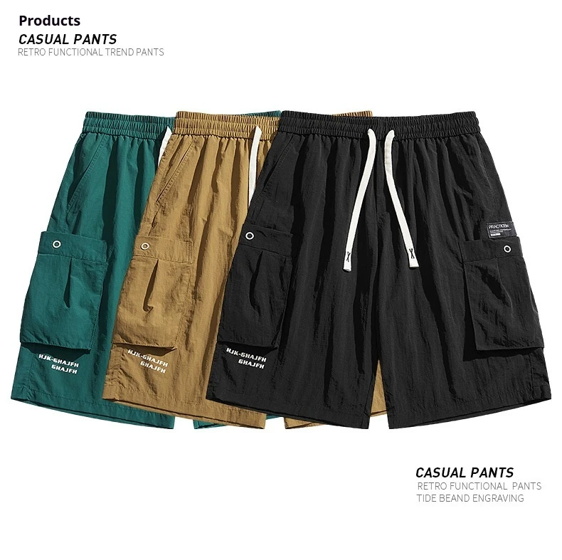 صيف جديد الرجال العلامة التجارية العصرية ملابس العمل السراويل الكورية فضفاضة كبيرة الحجم سراويل تقليدية تنفس التجفيف السريع أزياء الشارع