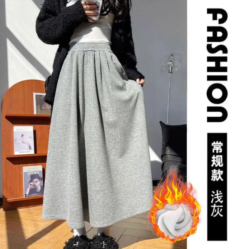 กระโปรงทรงเอไลน์สีข้าวเหนียวสีขาวข้าวโอ๊ต กระโปรงทรงเอไลน์ยาวปานกลางสำหรับผู้หญิง กระโปรงทรงเอไลน์ทรงร่ม สำหรับฤดูใบไม้ร่วงและฤดูหนาว กระโปรงลำลองเอวสูงสำหรับผู้หญิง สไตล์สบายๆ