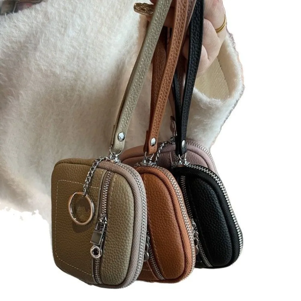 แฟชั่นซิปกระเป๋าใส่เหรียญหนัง PU พร้อมเชือกเส้นเล็กกระเป๋ารายการขนาดเล็กน้ําหนักเบาสีทึบลิปสติกหูฟังกระเป๋า