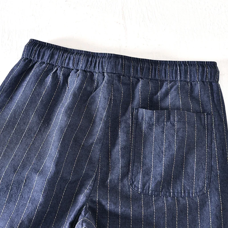 Pantaloncini in lino di cotone per uomo 2023 pantaloncini da vacanza larghi bianchi a righe di nuova moda uomo Casual Plus Size pantaloni corti con