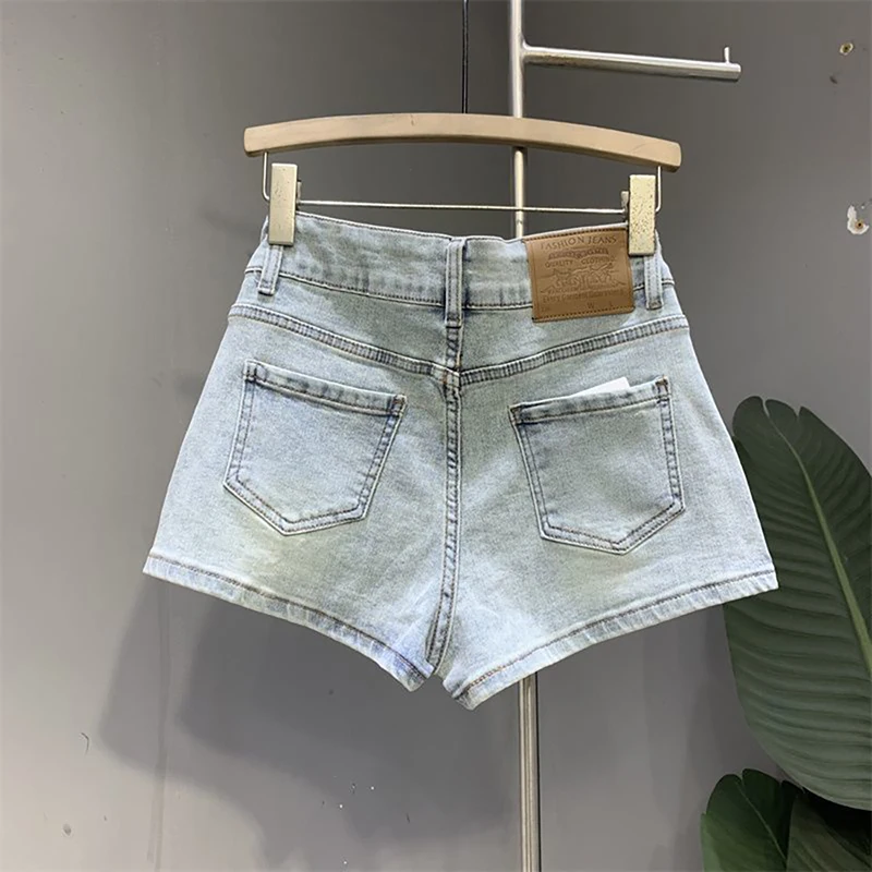 Falda corta vaquera azul claro para mujer, pantalones cortos acampanados falsos de dos piezas de cintura alta de estilo coreano, pantalones cortos de verano con botonadura, ropa de calle