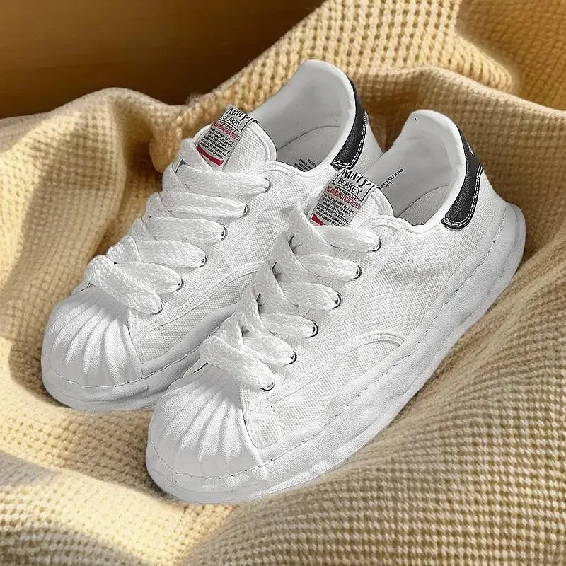 Eenvoudige en sfeervolle leren canvasschoenen en veelzijdige, ademende, comfortabele casual sportschoenen