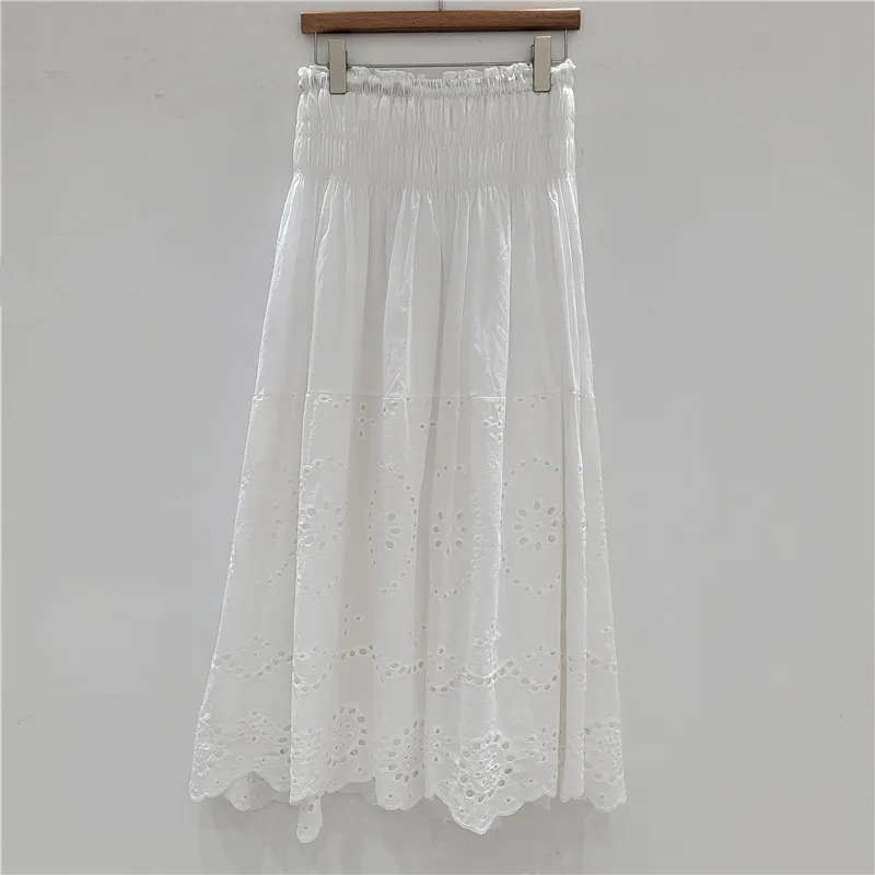 

Bohemian A-line skirt with intricate burnout lace delicate embroidery, and ruffle trim. Features an elastic high waist for a flt