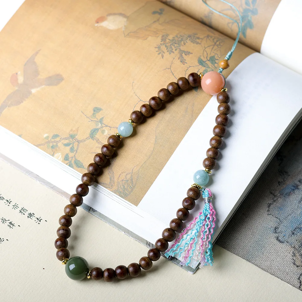 

Hand-woven single-strand yellow-hued agarwood pendant Original handcrafted Bodhi root Chinese-style phone chain and bag charm