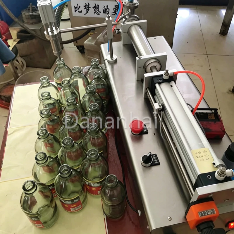 Portable Chinese Small Horizontal Liquid Filling Machine Single Head Fully Automatic for Precision Fillings