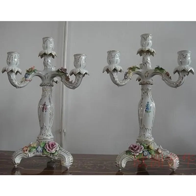 A pair of fine porcelain candle holders