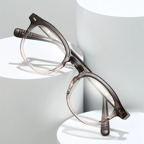 Imagen 2 del producto Gafas de lectura fotocromáticas Retro ultraligeras antiluz azul para hombre y mujer, gafas redondas decorativas con remaches a la moda de alta calidad