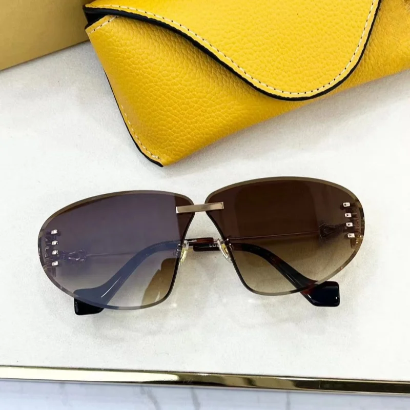 

2024 new fashion design rimless women's sunglasses travel personality sunglasses anti-uv glasses UV400