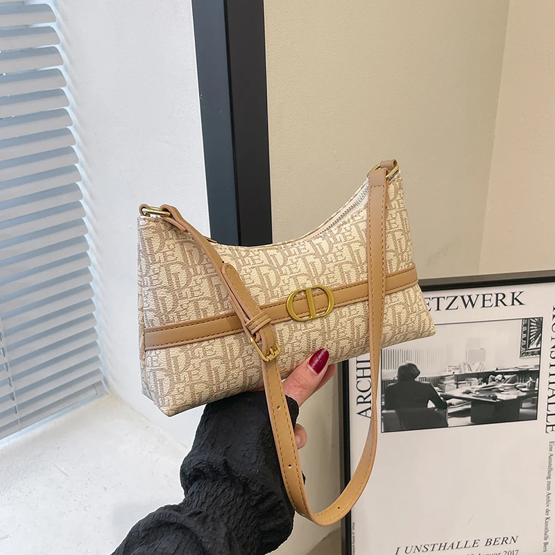 2025年新版 エレガントなトップハンドルバッグ チェーンディテール付き プレミアムスムースレザー デイトゥナイト 多用途 キャリーエッセンシャル