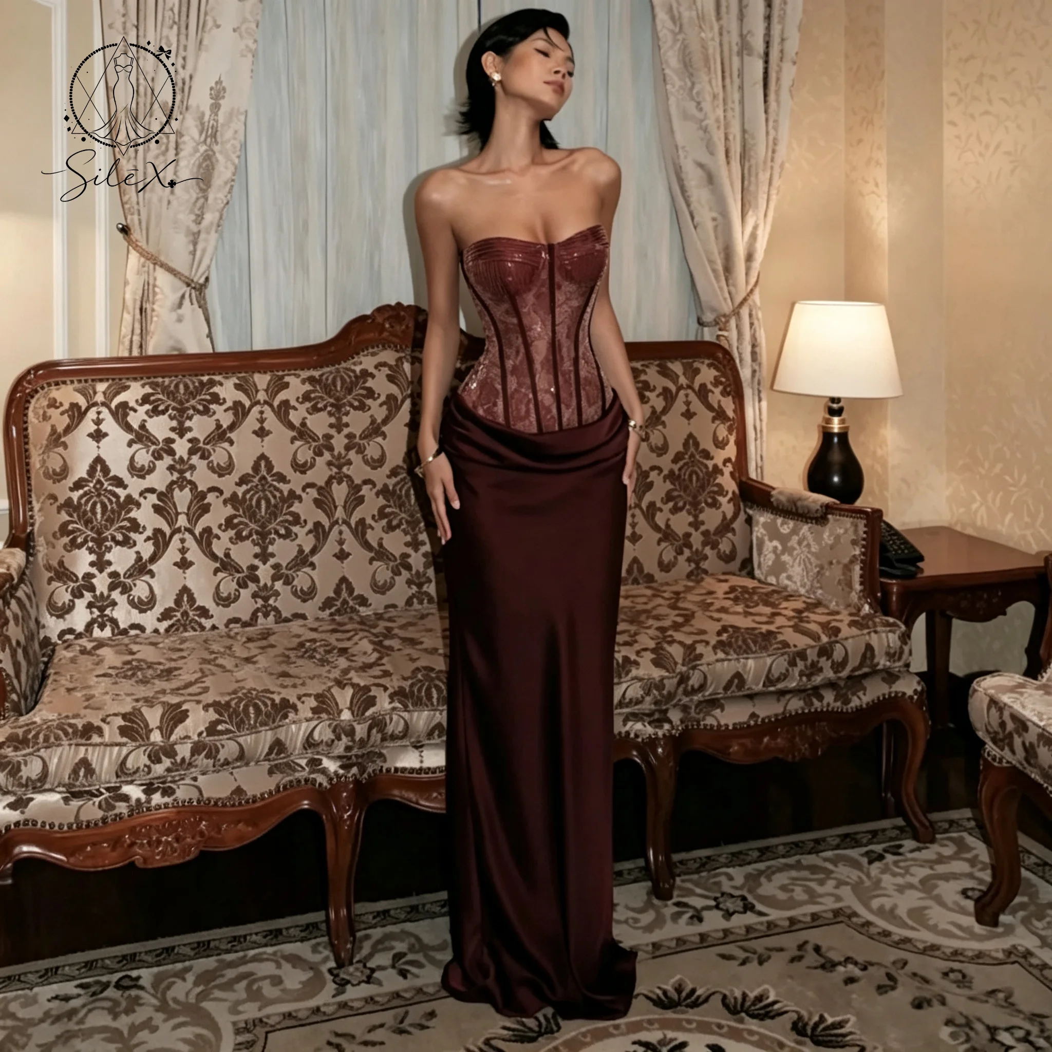 Red strapless sleeveless fish-tail floor-length formal ball gown with lace and bone-braided waistline